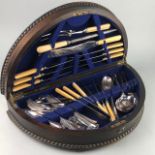 AN OAK CANTEEN, LOOSE CUTLERY AND SILVER PLATE