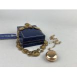 A GOLD PLATED SOVEREIGN CASE AND AN ENAMEL NECKLACE