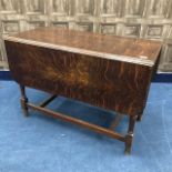 AN OAK DROP LEAF DINING TABLE