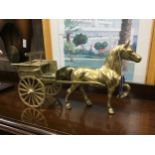 A PAIR OF BRASS HORSE DRAWN CARTS AND A CERAMIC MODEL OF A HORSE