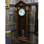 A 20TH CENTURY OAK CASED WALL CLOCK