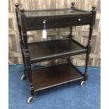 A STAINED WOOD THREE TIER TEA TROLLEY