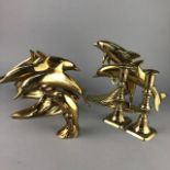 A PAIR OF BRASS CANDLESTICKS AND FOUR MODELS OF DOLPHINS