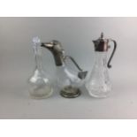 A DECANTER MODELLED AS A DUCK ALONG WITH FIVE OTHERS