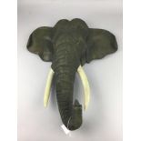 A PAIR OF WALL MOUNTING ELEPHANT HEADS