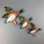 A LOT OF THREE GRADUATED BESWICK FLYING DUCK WALL PLAQUES