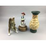 A MUSICAL CERAMIC FIGURE OF A BOY AND DOG ALONG WITH OTHER CERAMICS