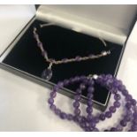 A CONTEMPORARY SILVER AND AMETHYST SET NECKLACE AND A TRIPLE STRAND BRACELET