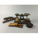 A SET OF POSTAL SCALES, A CARVED WOOD FIGURE AND TWO WHIST MARKERS