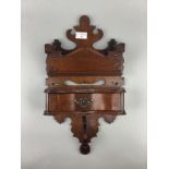 A VICTORIAN WALL HANGING LETTER RACK
