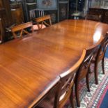 A MAHOGANY DINING SUITE