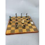 A PAINTED METAL WELLINGTON AND NAPOLEON CHESS SET