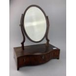 A MAHOGANY SERPENTINE FRONTED DRESSING MIRROR