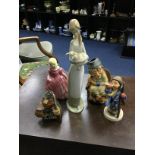 A LLADRO FIGURE OF A FEMALE ALONG WITH OTHER FIGURES