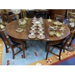 A MAHOGANY DINING TABLE