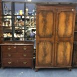 A MAHOGANY TWO DOOR WARDROBE AND A CHEST OF A DRAWERS