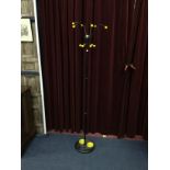 A RETRO BLACK ENAMELLED HAT AND COAT STAND