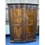 A MAHOGANY BOW FRONT WARDROBE