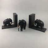 A PAIR OF EBONY BOOKENDS AND ELEPHNAT FIGURES