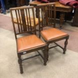 A PAIR OF 20TH CENTURY OAK DINING CHAIRS