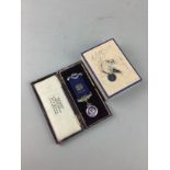 A RANGERS F.C. KEYRING AND AN ENAMELLED SILVER MASONIC BADGE