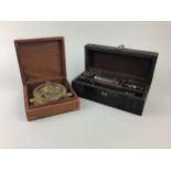 A BRASS COMPASS IN A WOOD BOX AND A NAUTICAL INSTRUMENT SET