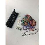 A COLLECTION OF BEADED NECKLACES AND OTHER ITEMS