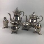 A SILVER PLATED FOUR PIECE TEA SERVICE AND TWO CANDLE HOLDERS