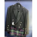 A KILT WITH DRESS WAISTCOAT AND PRINCE CHARLIE JACKET