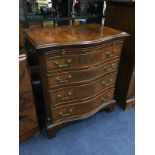 A WALNUT REPRODUCTION CHEST OF DRAWERS