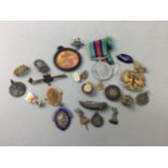 A COLLECTION OF ENAMELLED BADGES AND PENDANTS