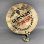 A GUINNESS ADVERTISEMENT BODHRUM DRUM WITH A TOUCAN