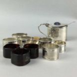 A SILVER MUSTARD POT AND SILVER AND OTHER NAPKIN RINGS