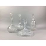 A LOT OF FOUR CRYSTAL DECANTERS WITH STOPPERS