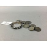 A SILVER BANGLE AND COIN BRACELET