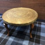 A BRASS TOPPED OCCASIONAL TABLE