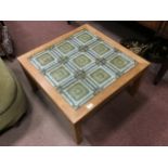 A RETRO TILE TOPPED COFFEE TABLE