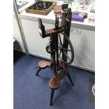 AN EARLY 20TH CENTURY MAHOGANY SPINNING WHEEL