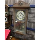 A REPRODUCTION MAHOGANY CASED WALL CLOCK