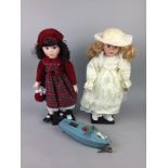 A CLOCKWORK TIN PLATE MODEL BOAT AND VINTAGE DOLLS