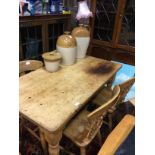 A PINE BREAKFAST TABLE AND FOUR CHAIRS
