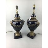 A PAIR OF REPRODUCTION TABLE LAMPS WITH RED SHADES