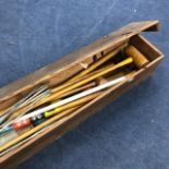 A VINTAGE CROQUET SET CONTAINED IN A WOOD BOX