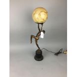 AN ART DECO GILT METAL LAMP