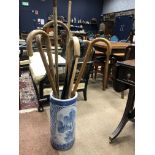 A 20TH CENTURY CHINESE CERAMIC STICK STAND AND WALKING STICKS