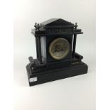 A VICTORIAN BLACK SLATE MANTEL CLOCK