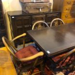 AN ERCOL DRESSER, DINING TABLE AND SIX CHAIRS