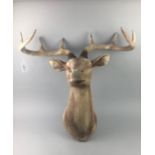 A CARVED WOOD WALL MOUNTING STAG'S HEAD