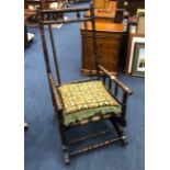 A 19TH CENTURY AMERICAN SPRING ROCKING CHAIR