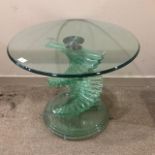 A GLASS TOPPED OCCASIONAL TABLE